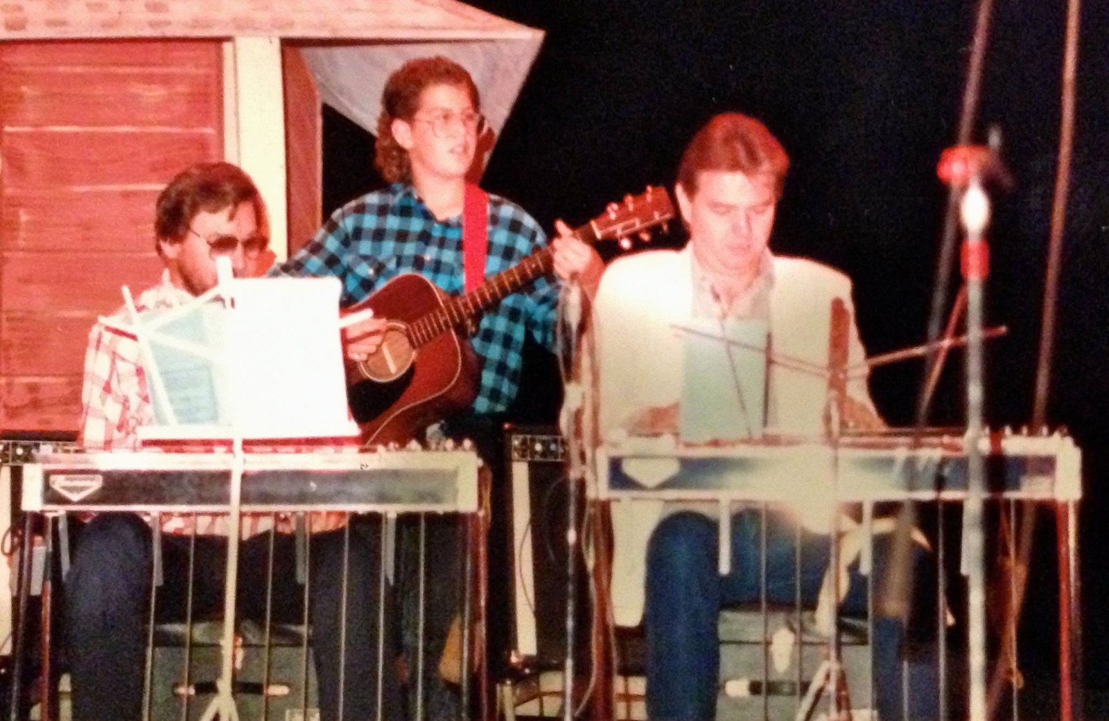 Jeremy performing on stage with his father and grandfather