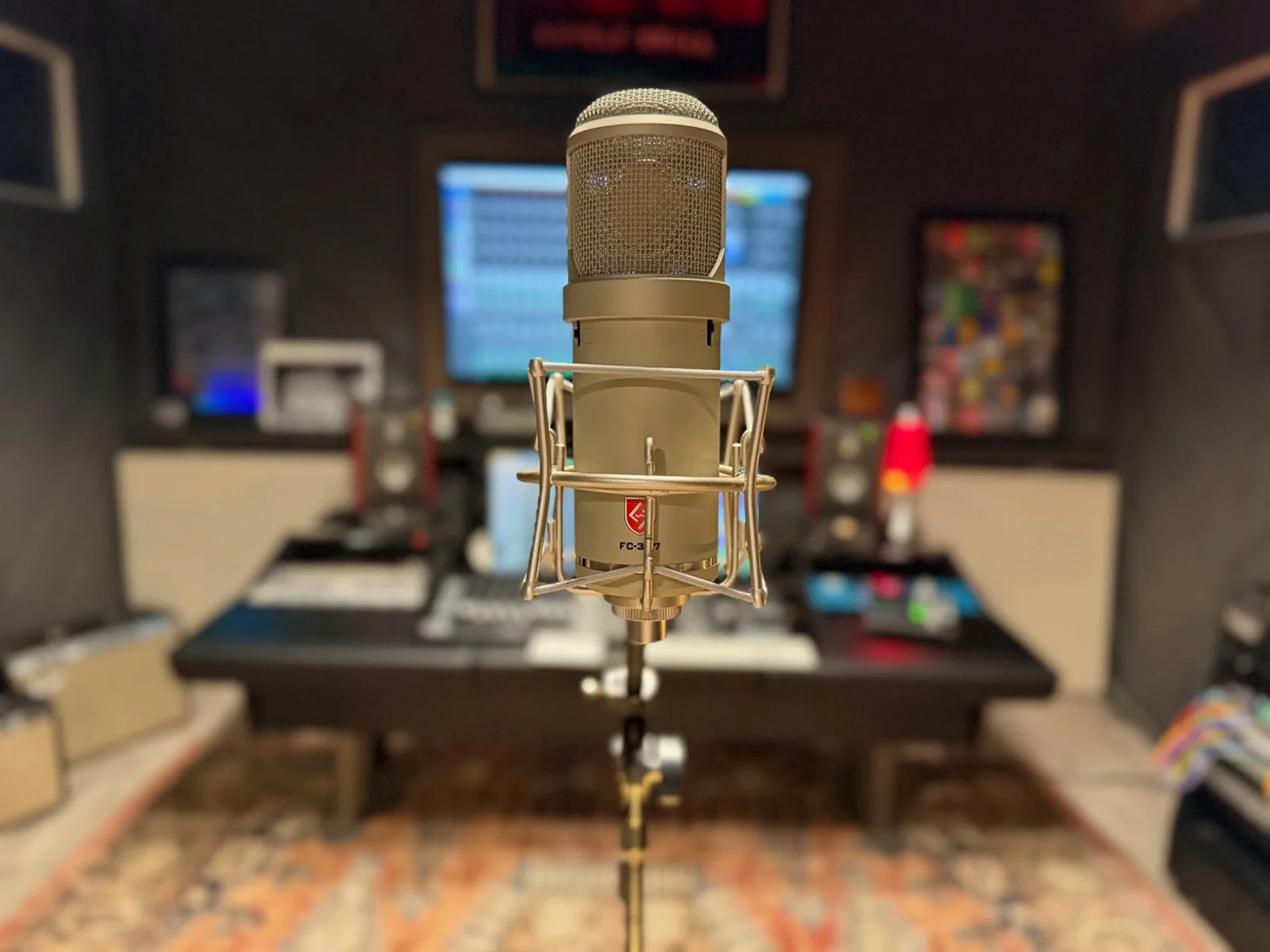 Singer perspective facing a studio microphone and control position